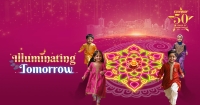 Sunway Deepavali 2024’s Illuminating Tomorrow key visual, featuring young children amidst a pink background and Sunway City Kuala Lumpur skyline.