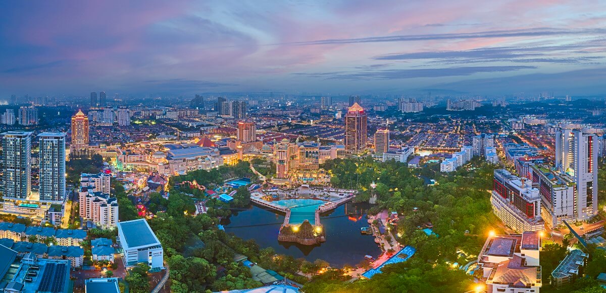 A drone shot of Sunway City Kuala Lumpur (SCKL) at dusk overseeing the iconic monuments such as Sunway Medical, Sunway Lagoon, Sunway Pyramid, Sunway University and more.