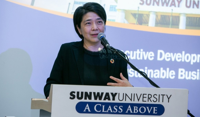 A mid shot of Ms. Foo Shiang Wyne delivering a speech at Sunway University for the Sunway Executive Development Programme for Sustainable Leadership.