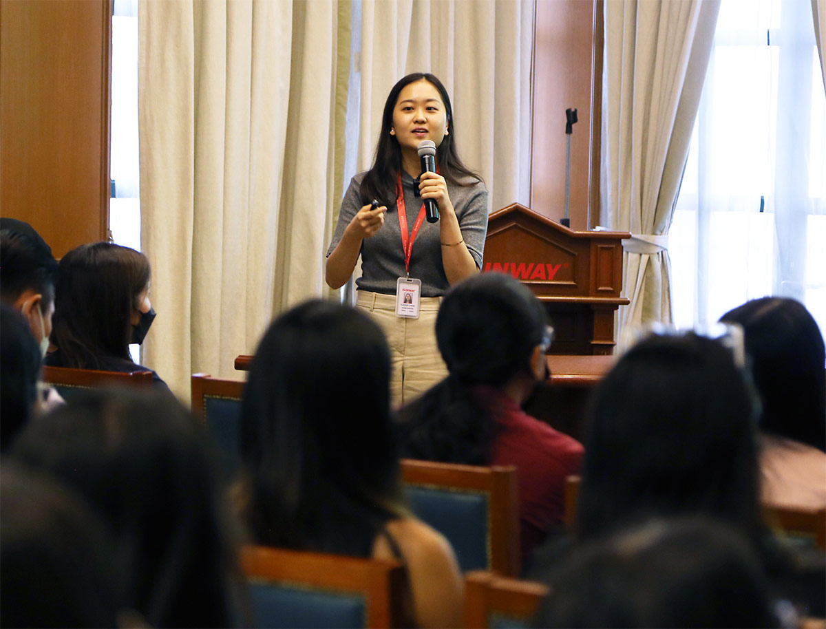 A far shot of a Sunway staff giving a presentation