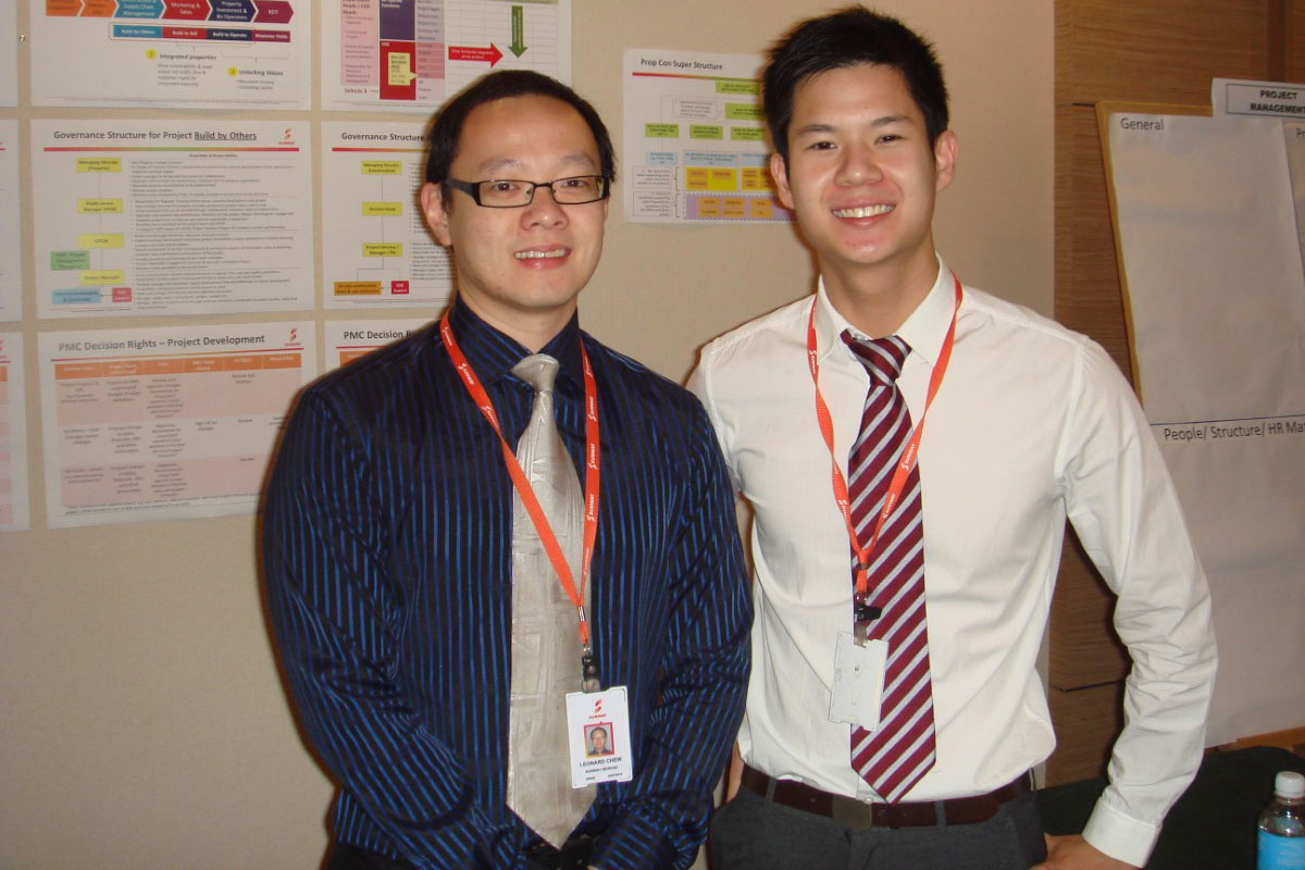 Two men in formal attire standing side by side for a photo.